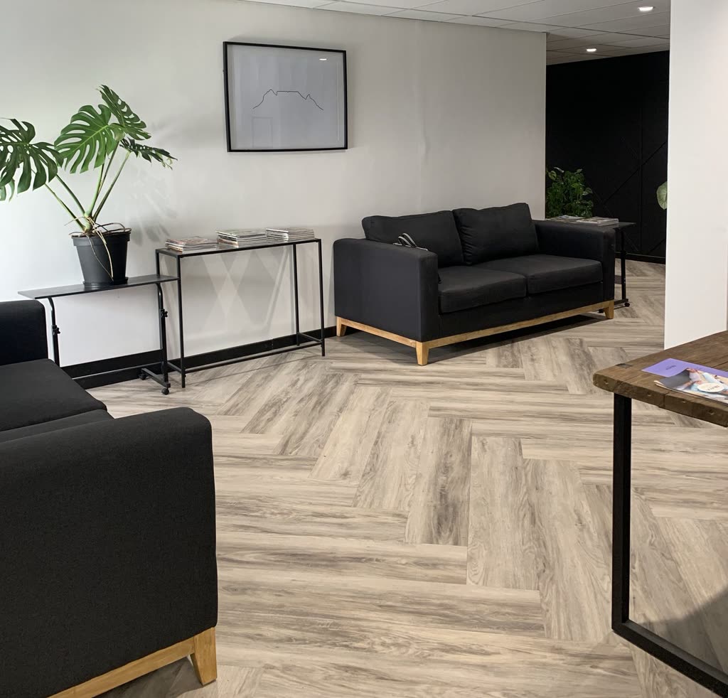 D-VELOPE completed interior with monochrome seating and herringbone flooring